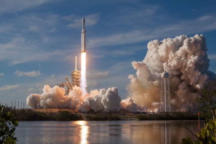 image of spaceship taking off with rocket fire and smoke